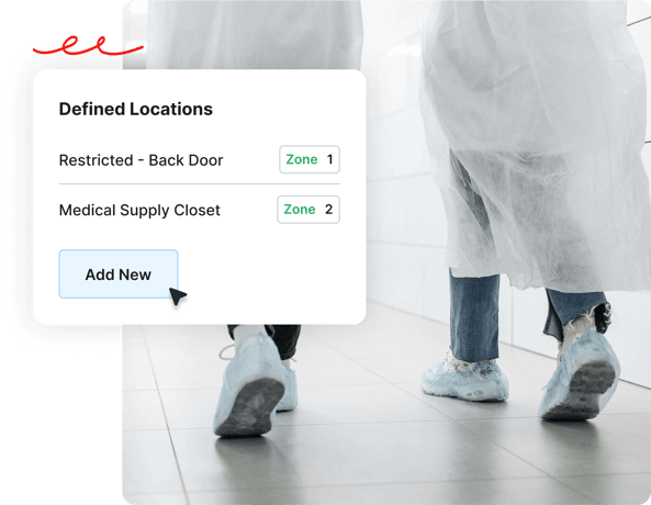 Two people in lab coats and shoe covers walk past a screen listing defined locations and zones with an Add New button.