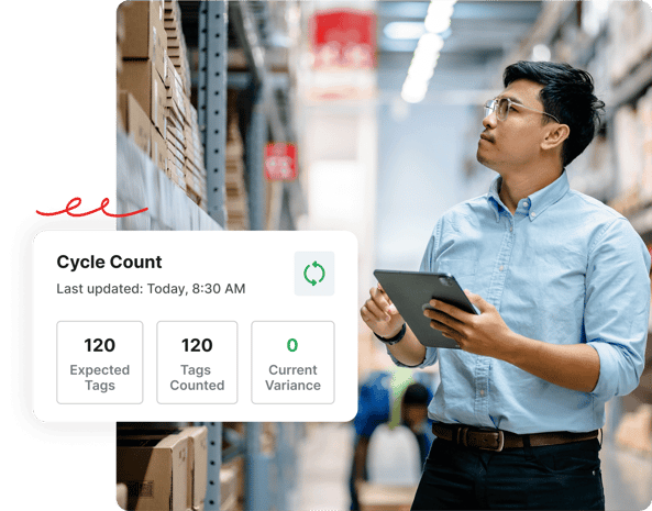 Man holding a tablet in a warehouse, with a cycle count inventory dashboard showing zero variance.
