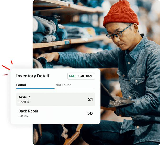 Person in beanie checks inventory with laptop in clothing store; inventory details shown in pop-up window.