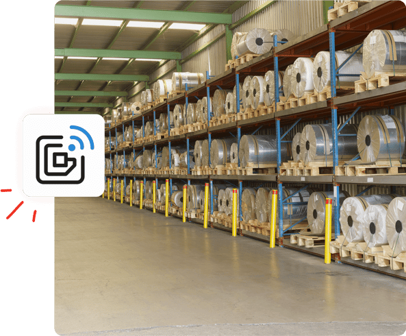 Rows of large metal coils stored on shelves in a warehouse, with a digital document icon overlaid on the image.