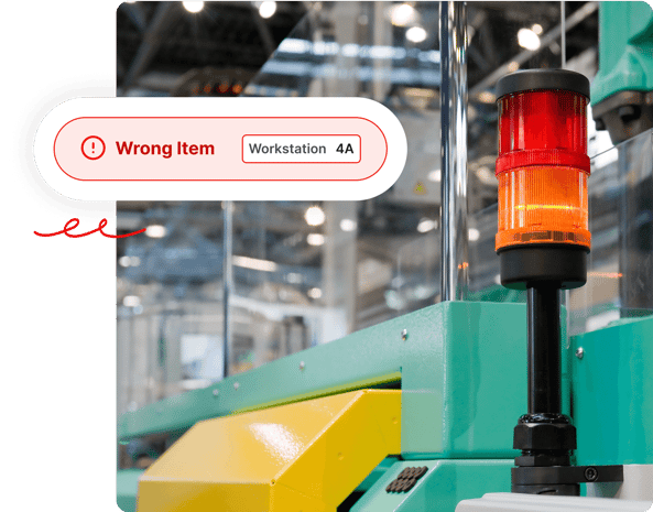 A warning light on factory equipment with an alert: Wrong Item, Workstation 4A.