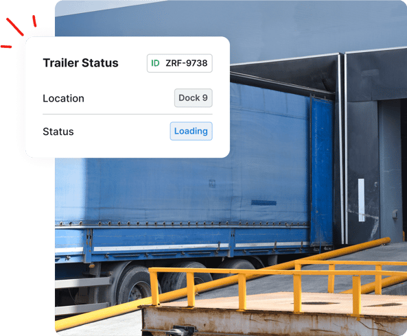 A blue trailer at a loading dock with an on-screen status showing Dock 9 and Loading.